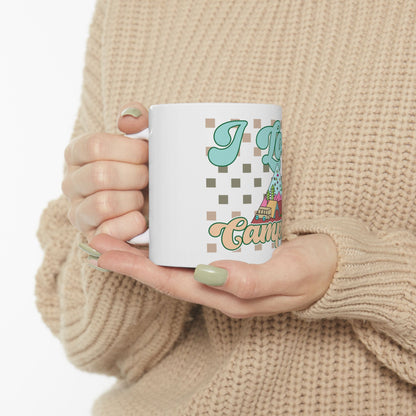 Mug with "I Love Camping" text and cartoon camper.