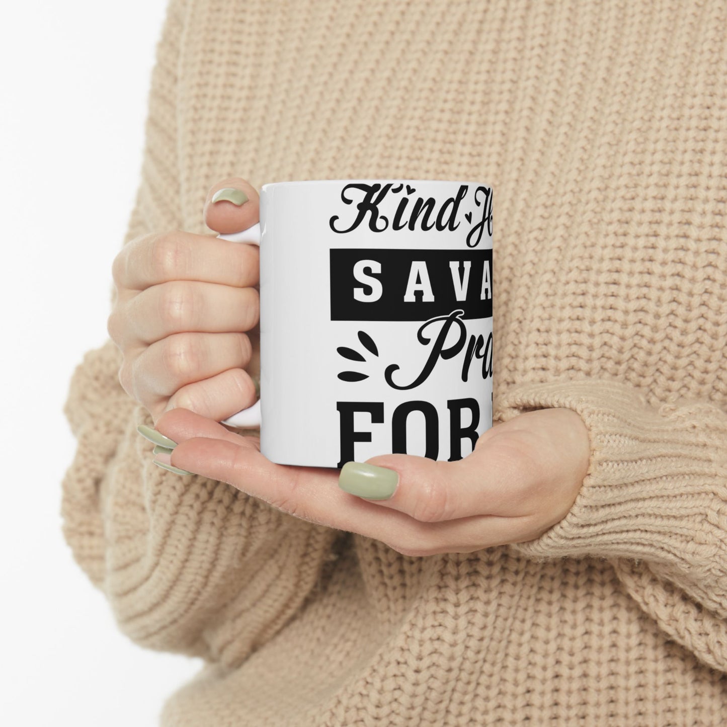 White mug with text "Kind of a big deal" held by hands.
