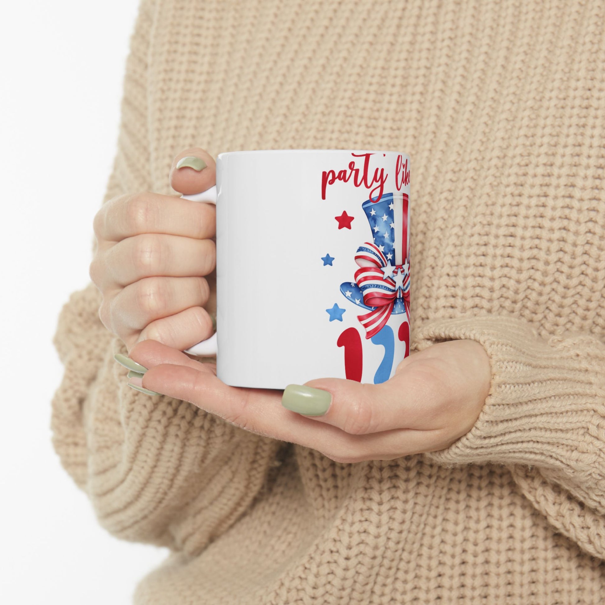 White mug with "party like it's 1776" and patriotic hat graphic.