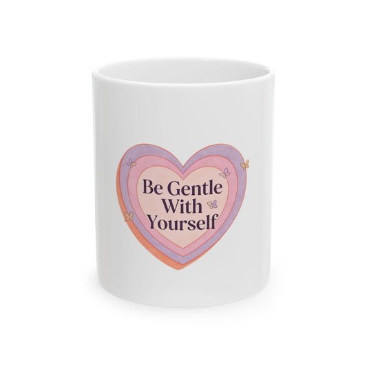 White mug with heart graphic and text "Be Gentle With Yourself".