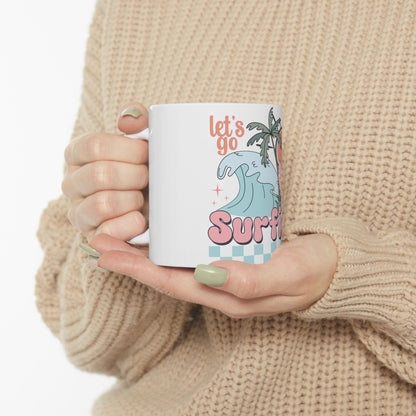 White mug with "Let's go Surfi" text, palm tree, and wavy blue graphics.