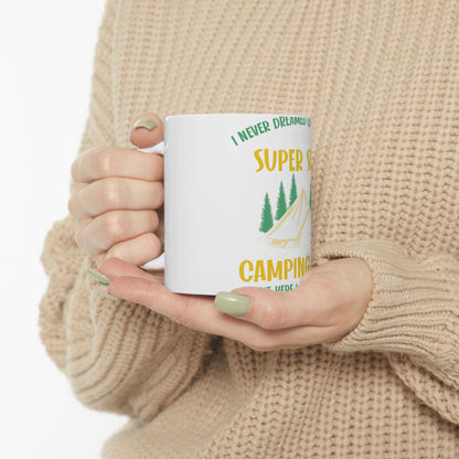 White mug with green text about camping and pine trees.