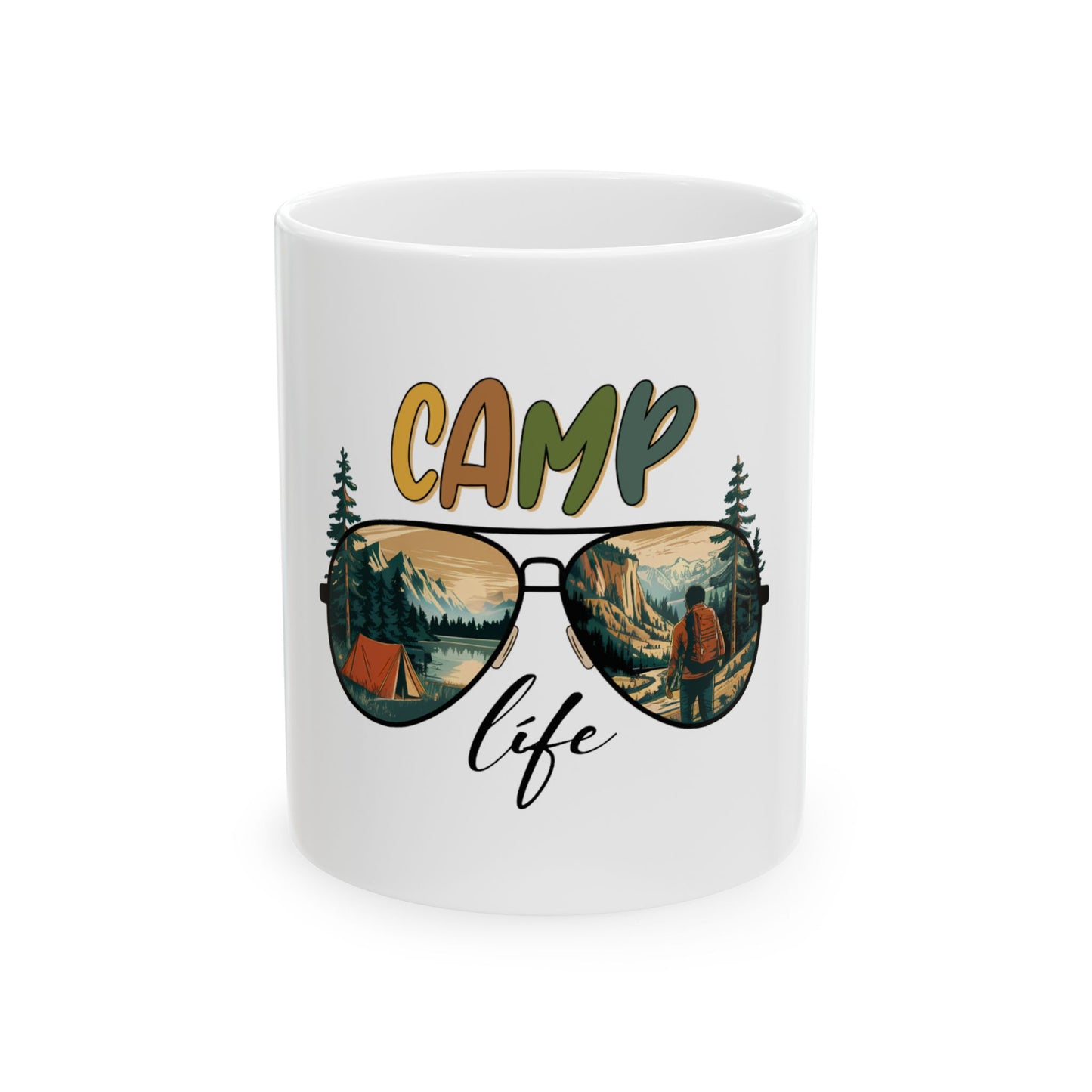 White mug with "CAMP life" text and sunglasses reflecting a mountain landscape.
