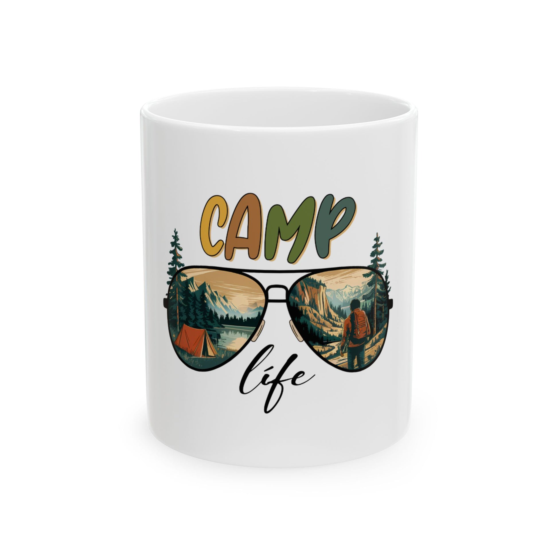 White mug with "CAMP life" text and sunglasses reflecting a mountain landscape.