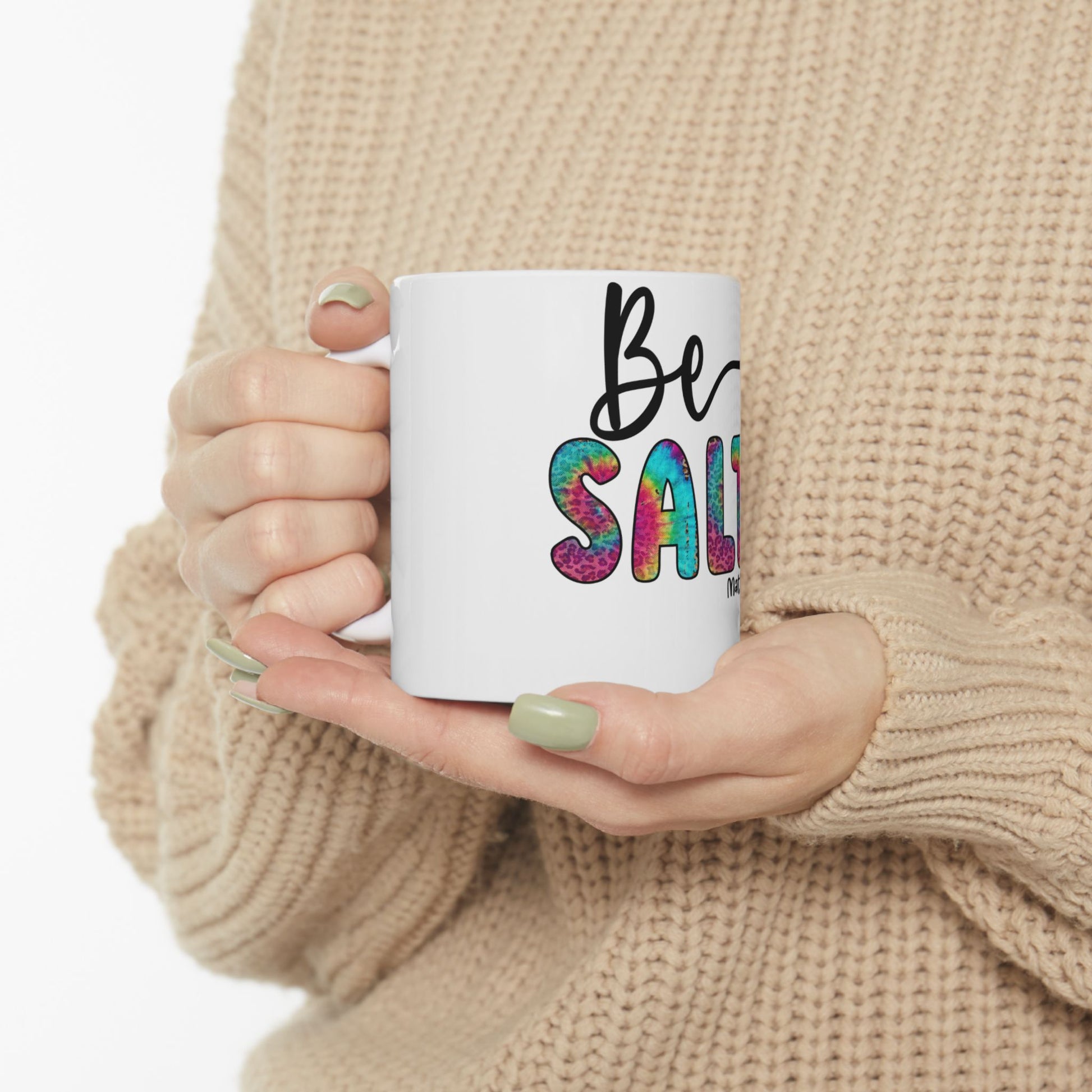 White mug with "Be SALTY" text in colorful tie-dye lettering.