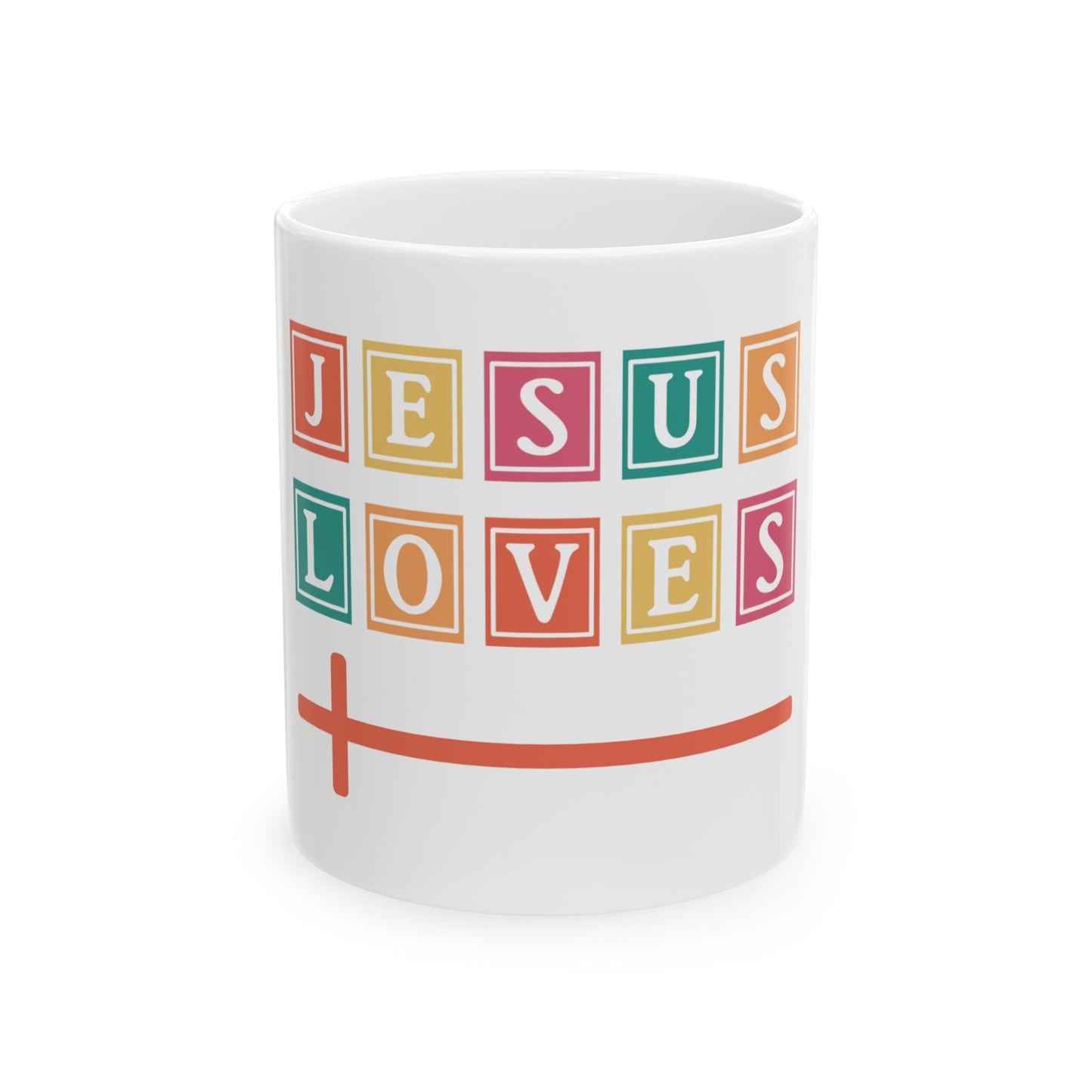White mug with "Jesus Loves" in colorful blocks and an orange cross.