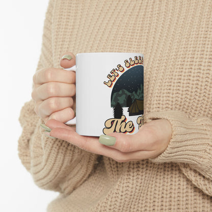 White mug with "Let's Sleep In" text and a camping scene graphic.