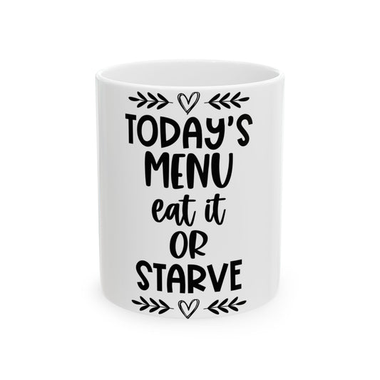 White mug with "TODAY'S MENU: EAT IT OR STARVE" text.