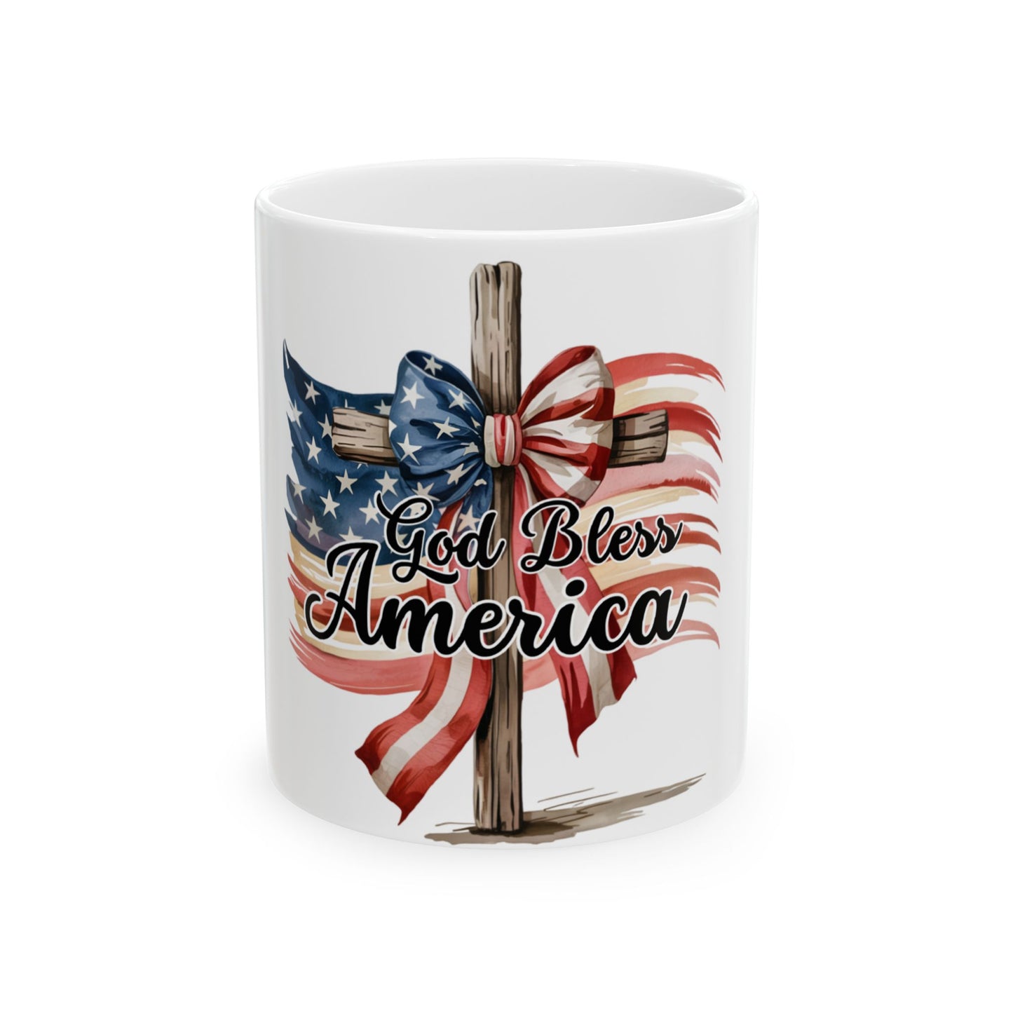 White mug with American flag cross, bow, and "God Bless America" text.