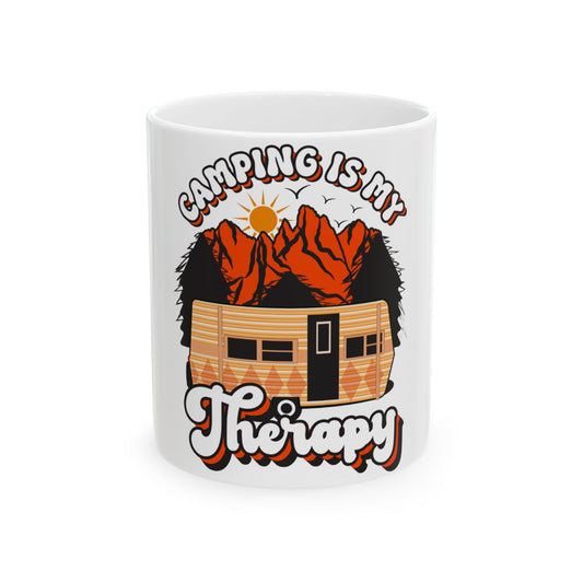 White mug with "Camping is My Therapy" text and a graphic of a camper and mountains.