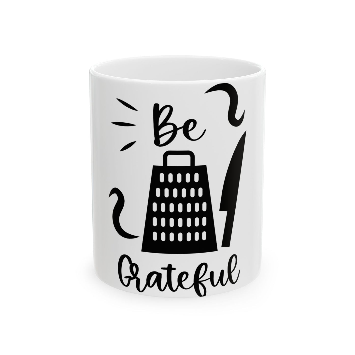 White mug with "Be Grateful" and grater and knife graphics.