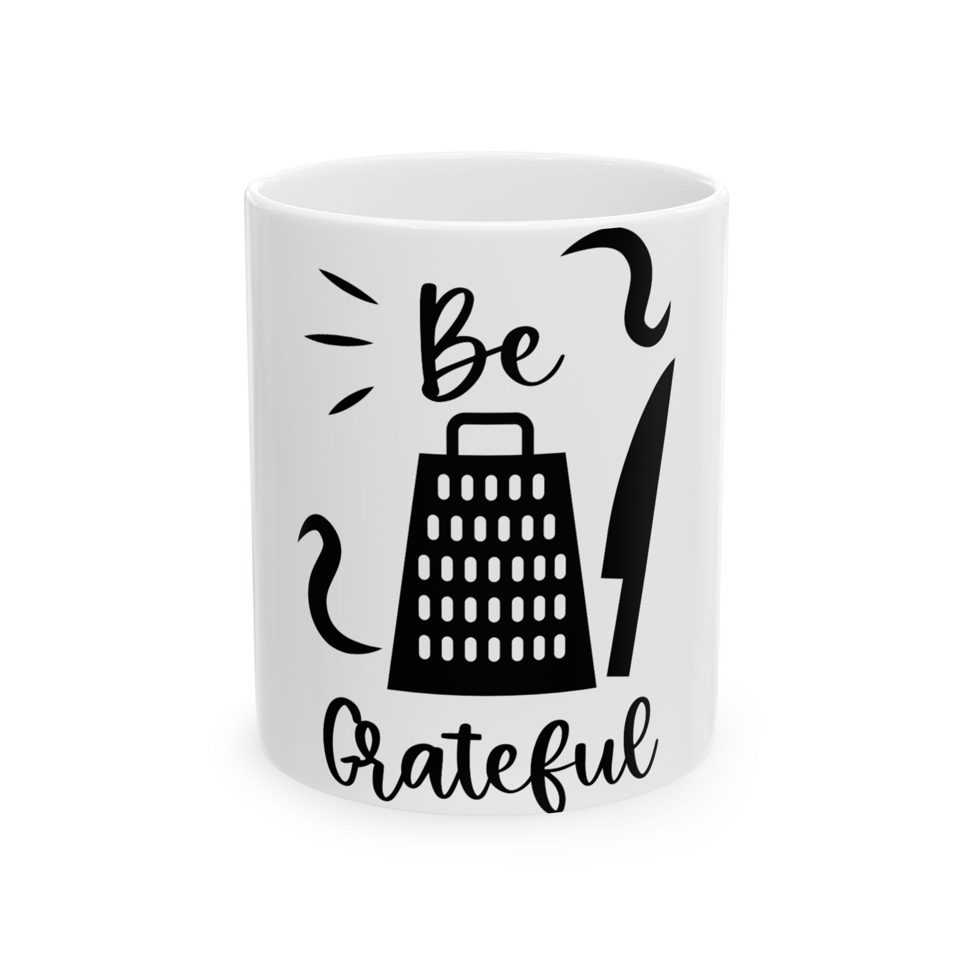 White mug with "Be Grateful" and grater and knife graphics.
