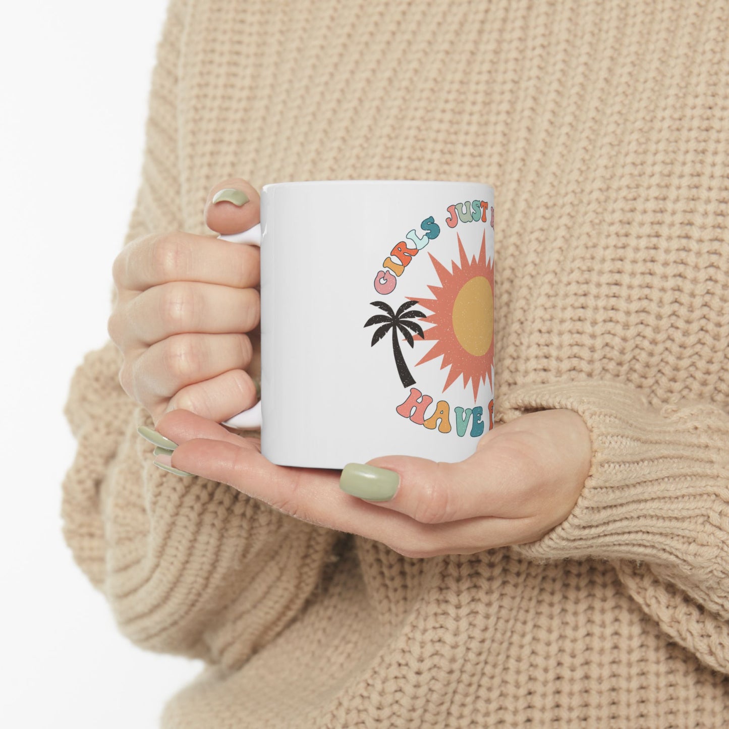 White mug with "Girls Just Wanna Have Fun" text and sun graphic.