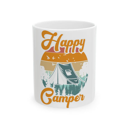 Mug with "Happy Camper" text, tent, and sunset forest scene.