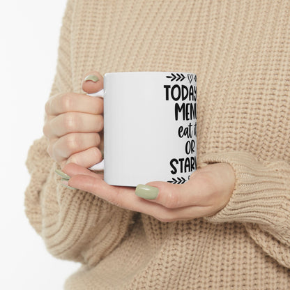 White mug with "Today, eat it or starve" text.