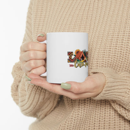 White mug with "Camping" text and colorful desert sunset graphics.