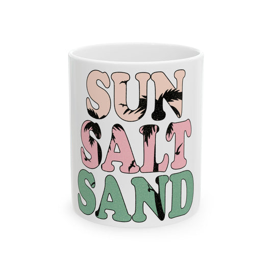 White mug with "SUN SALT SAND" in colorful palm tree-filled letters.