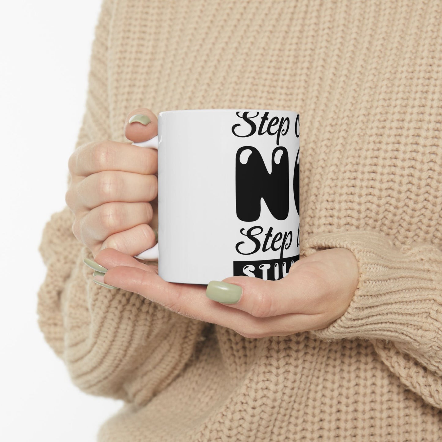 White mug held by hands, with text "Step" and "One" in black.