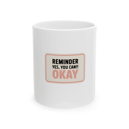 White mug with "REMINDER YES, YOU CAN!! OKAY" text.