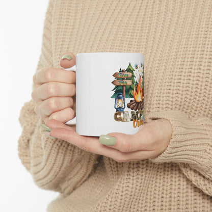 White mug with "Camping Chaos" and woodland scene art.