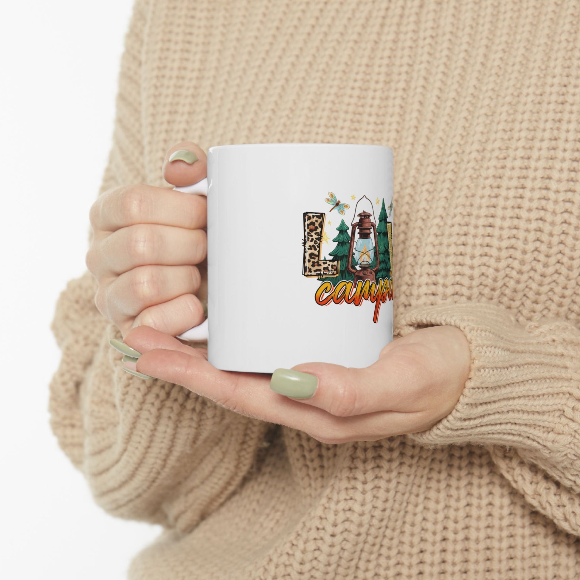White mug with "Camping" text, lantern, and woodland animals.