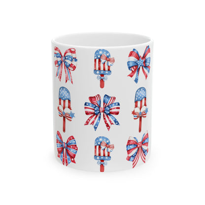 Patriotic bows and popsicle graphics on a white mug.