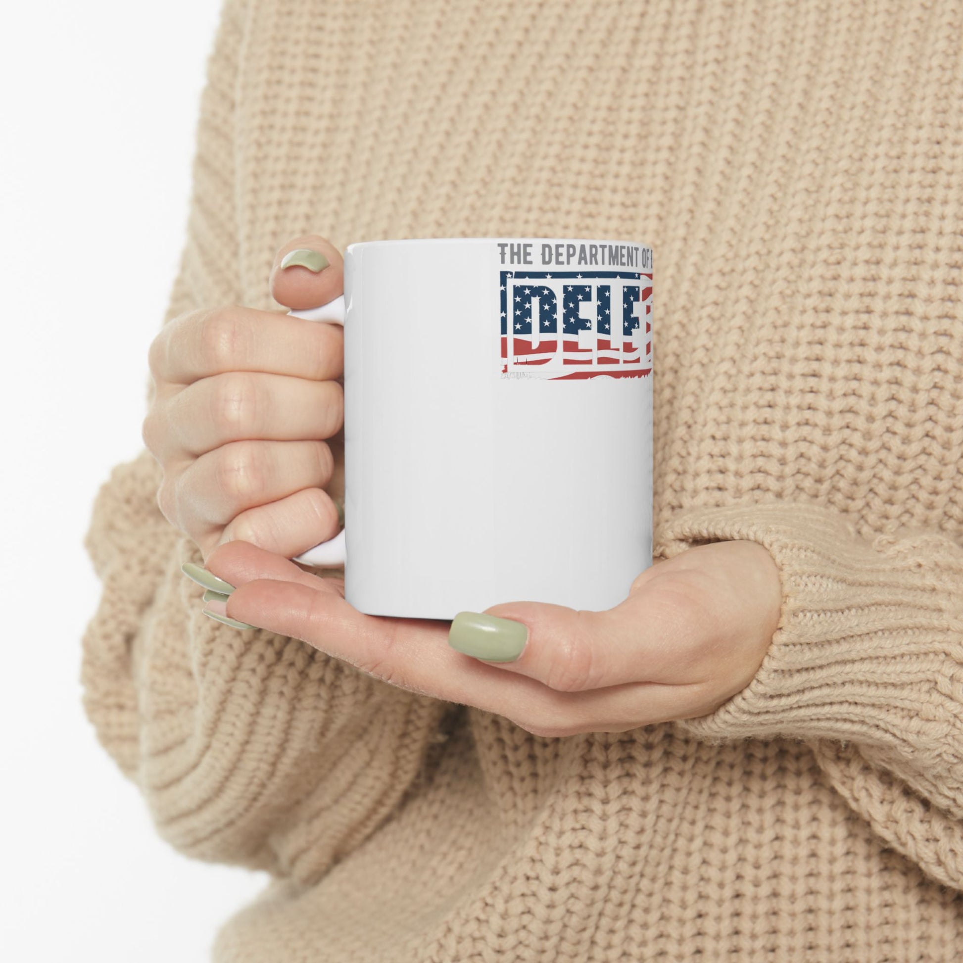 White mug with "THE DEPARTMENT OF" and an American flag design spelling "DELF".