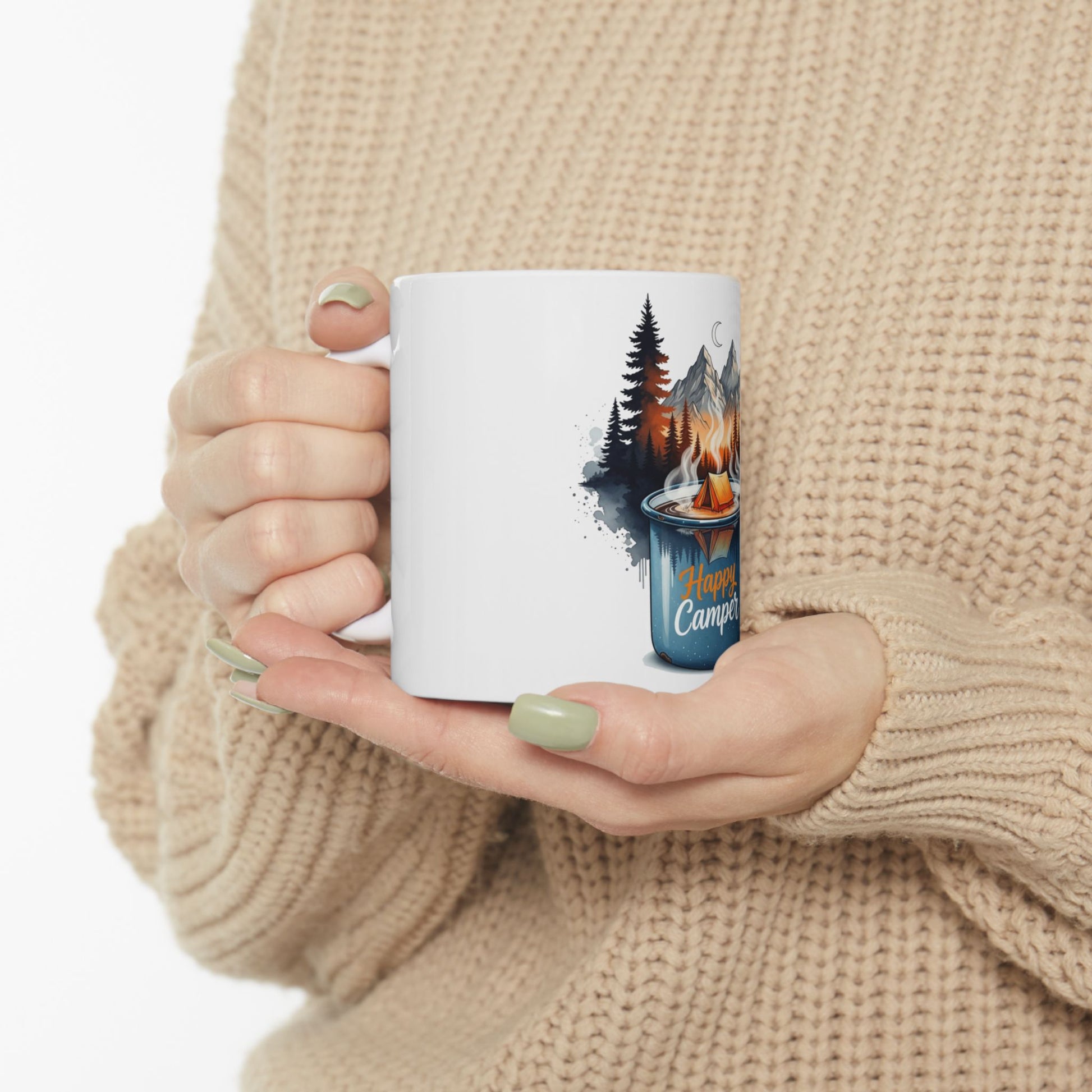 White mug with camping scene and "Happy Camper" text.