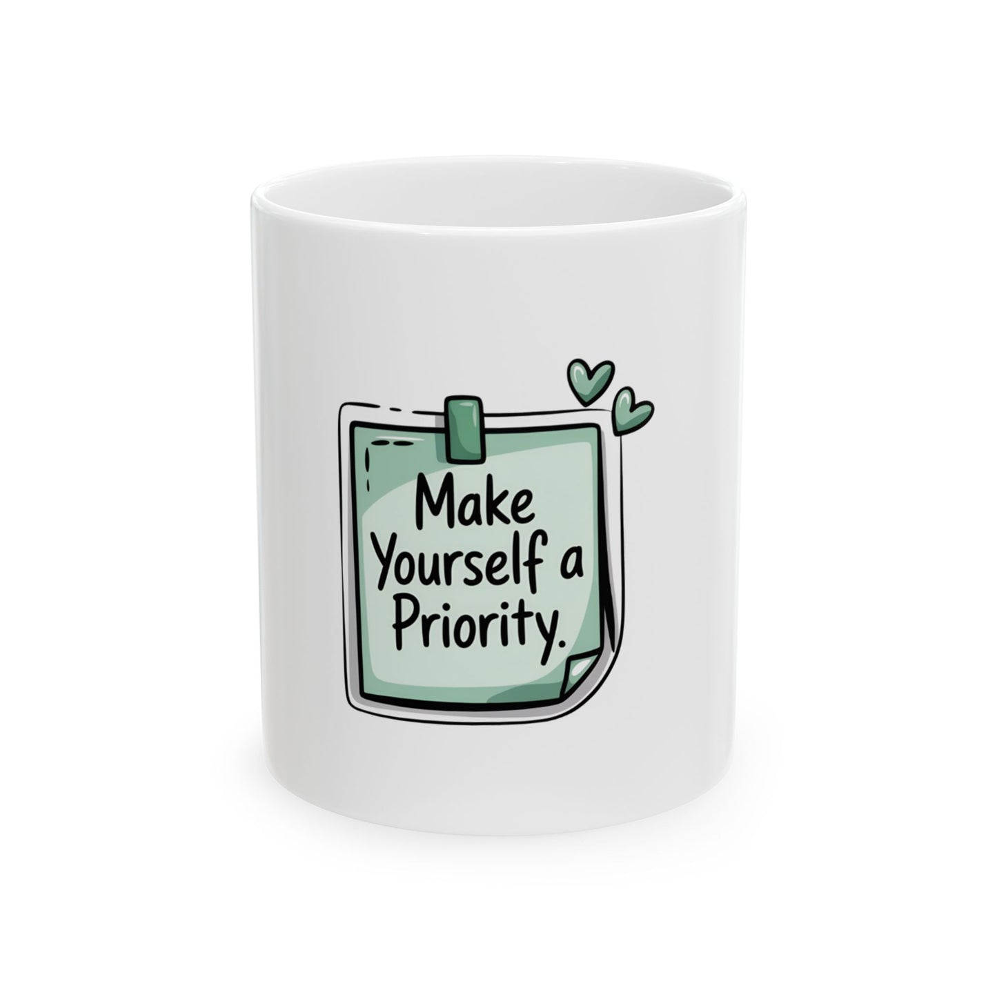 White mug with "Make Yourself a Priority" and green hearts on a sticky note design.