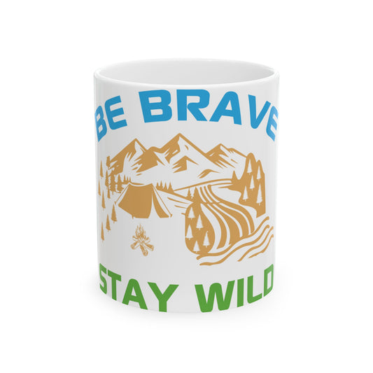 Mug with mountains, trees, tent, and text "BE BRAVE STAY WILD".