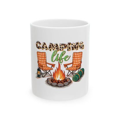 White mug with "Camping Life" text, campfire, two chairs, and sleeping bag.