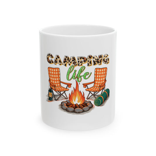 White mug with "Camping Life" text, campfire, two chairs, and sleeping bag.