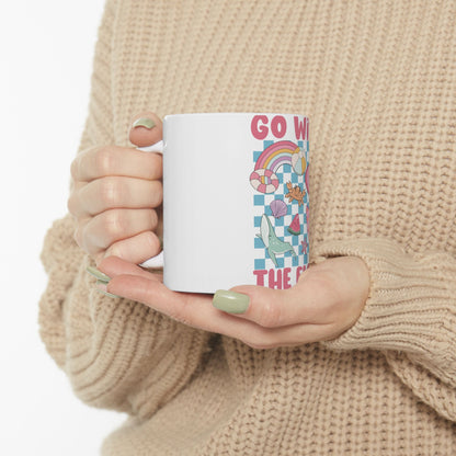 White mug with colorful "GO WI" text and checkered pattern.