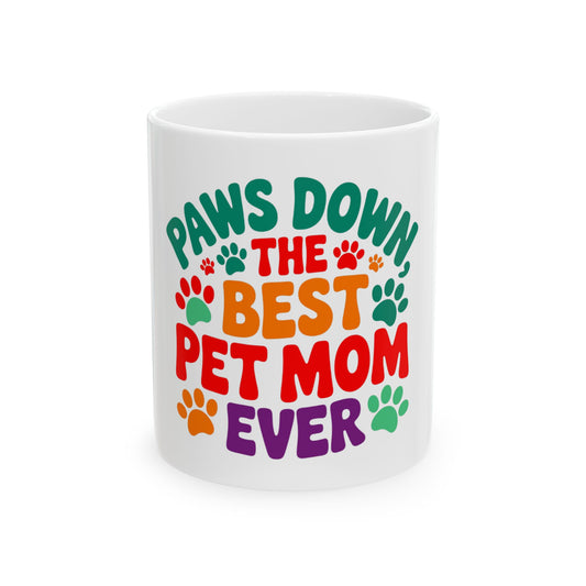 White mug with "Paws Down The Best Pet Mom Ever" text and paw prints.
