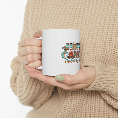 White mug with "Campfire Fueled by Coffee" text and camping graphics.
