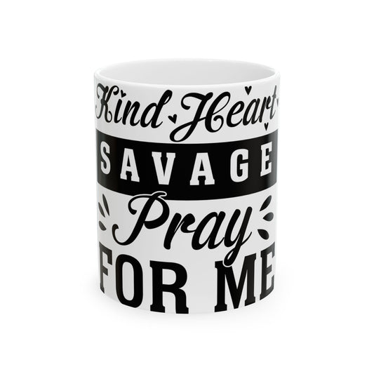 White mug with black text "Kind Heart Savage Pray For Me".