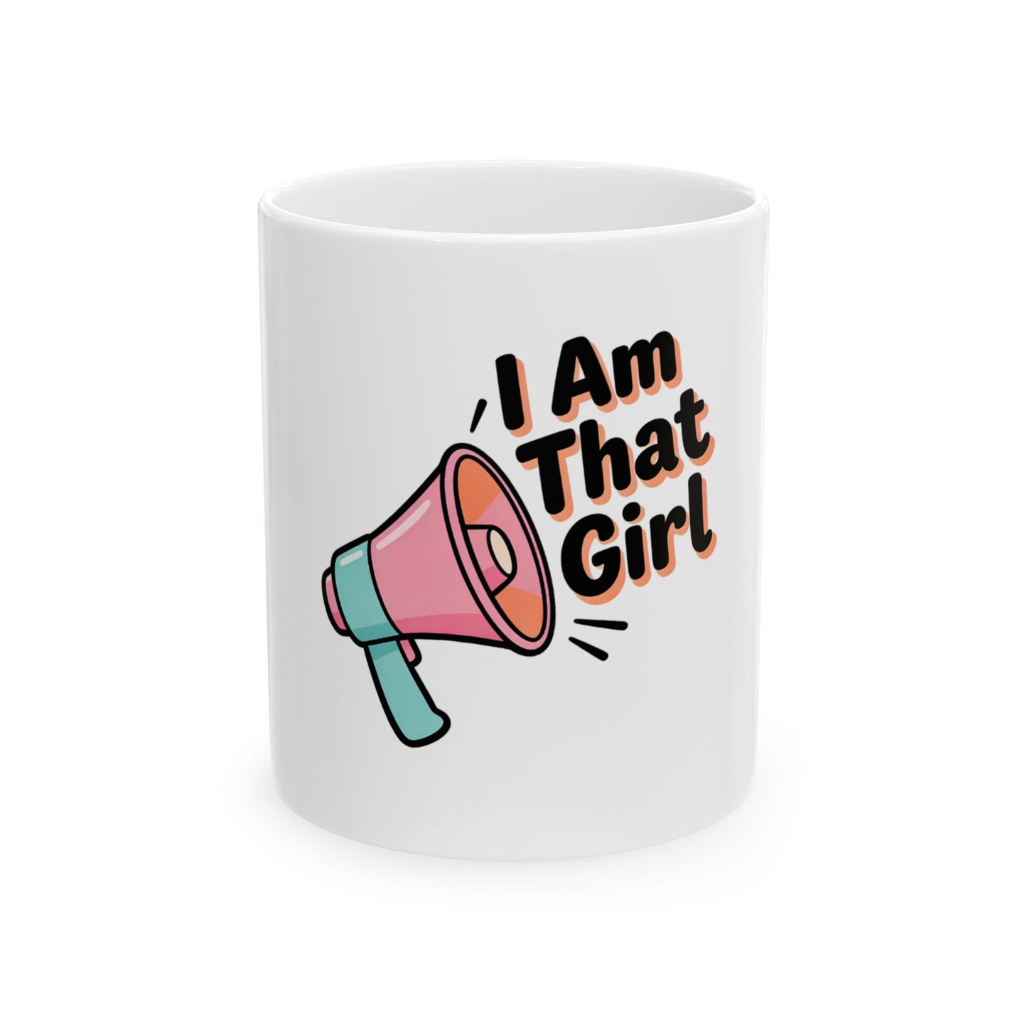 White mug with a pink and teal megaphone graphic and text "I Am That Girl."