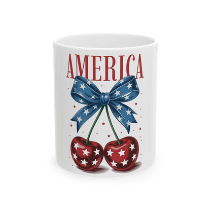 Mug with "AMERICA" text, red cherries, and blue bow with white stars.