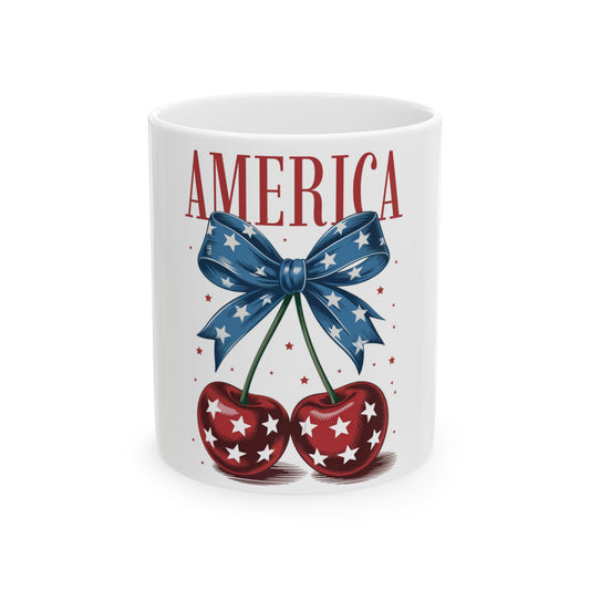 Mug with "AMERICA" text, red cherries, and blue bow with white stars.