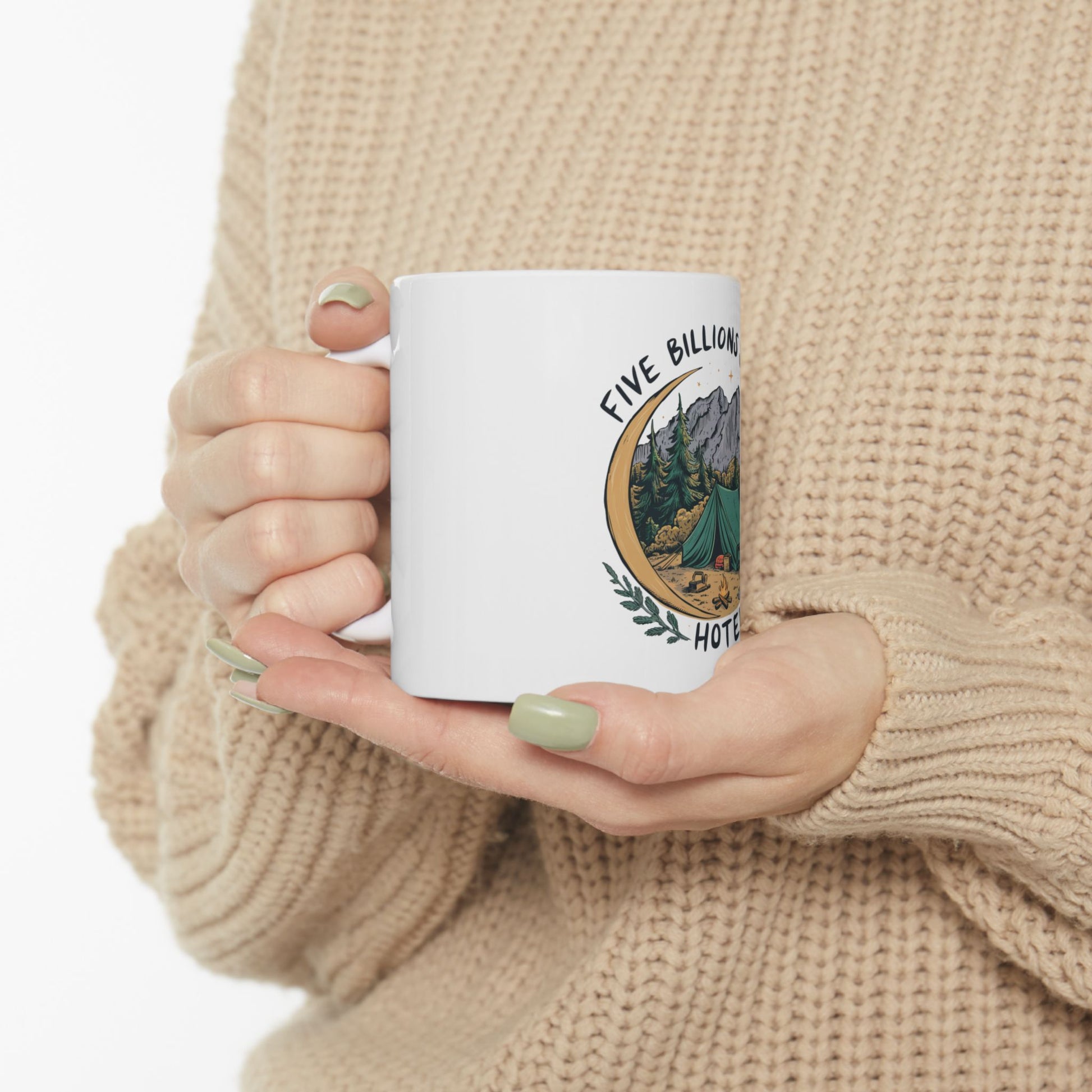 White mug with "Five Billion Hotels" text and mountain camping scene graphic.