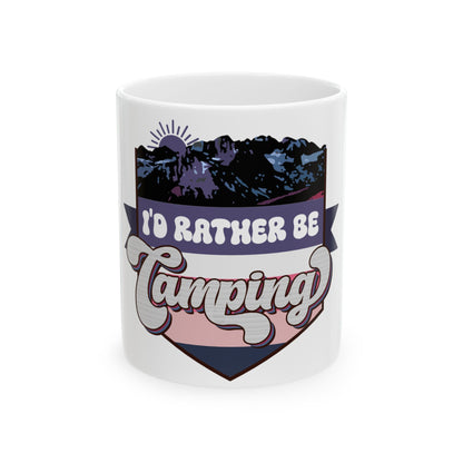 White mug with "I'd Rather Be Camping" text and mountain sunset graphic.