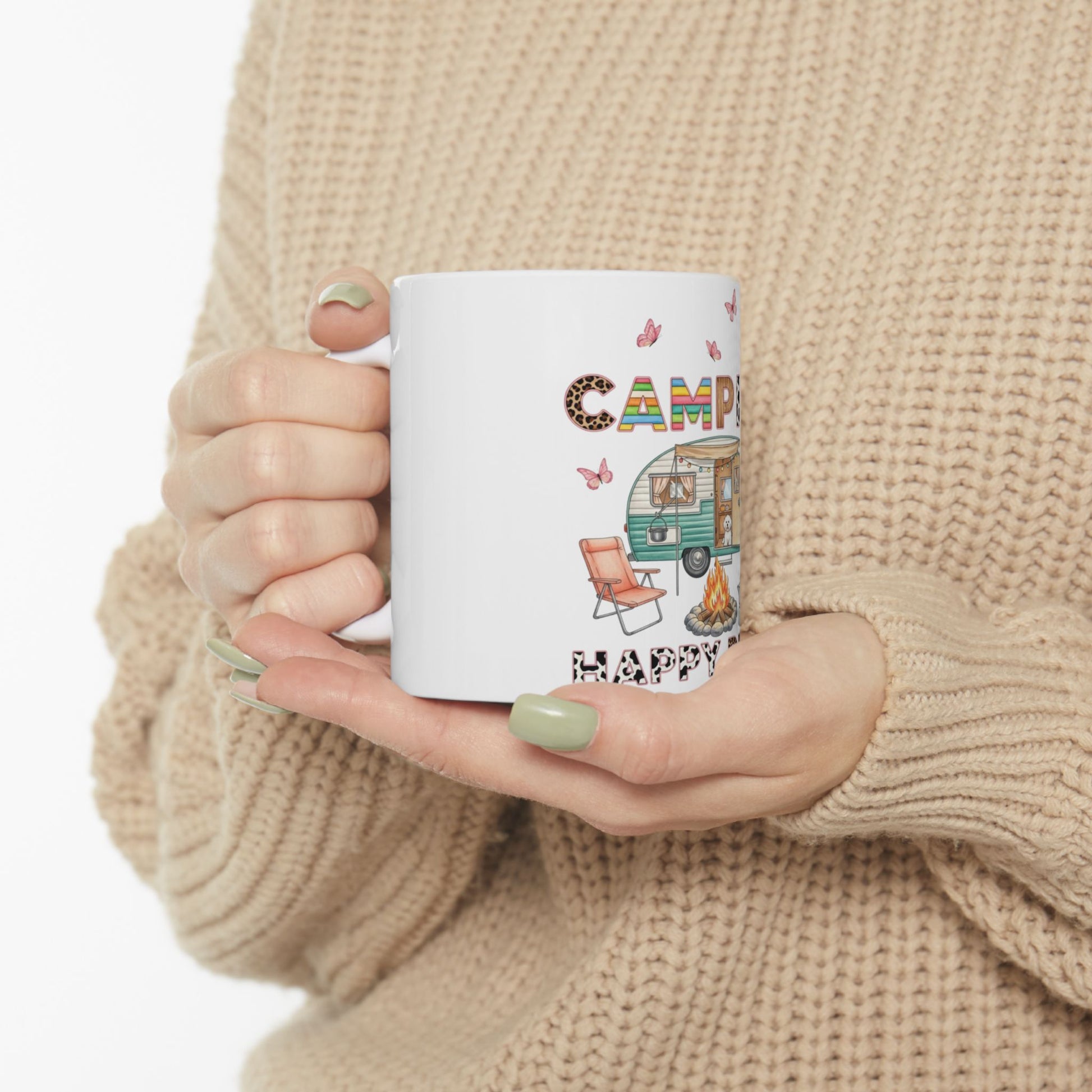 Mug with colorful camper, campfire, and "CAMPING HAPPY" text.