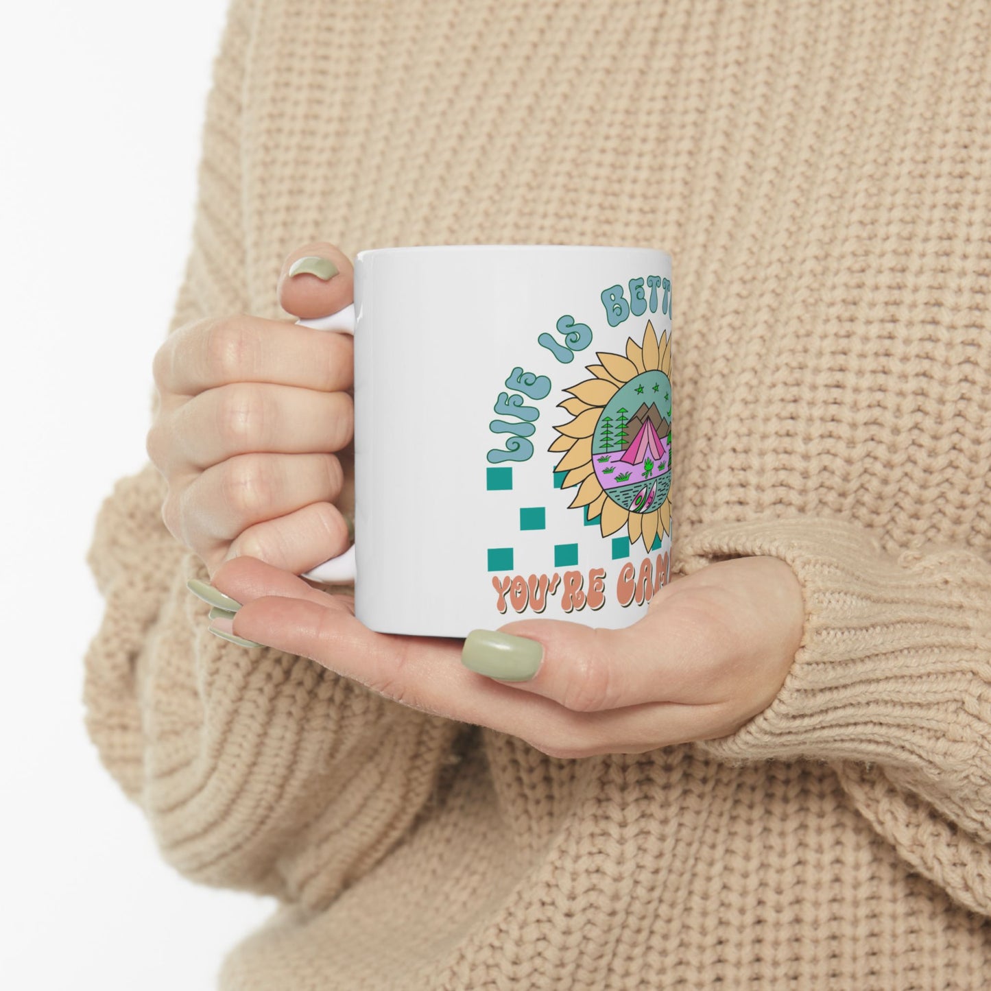 White mug with sunflower and text "Life is better when you're camping".