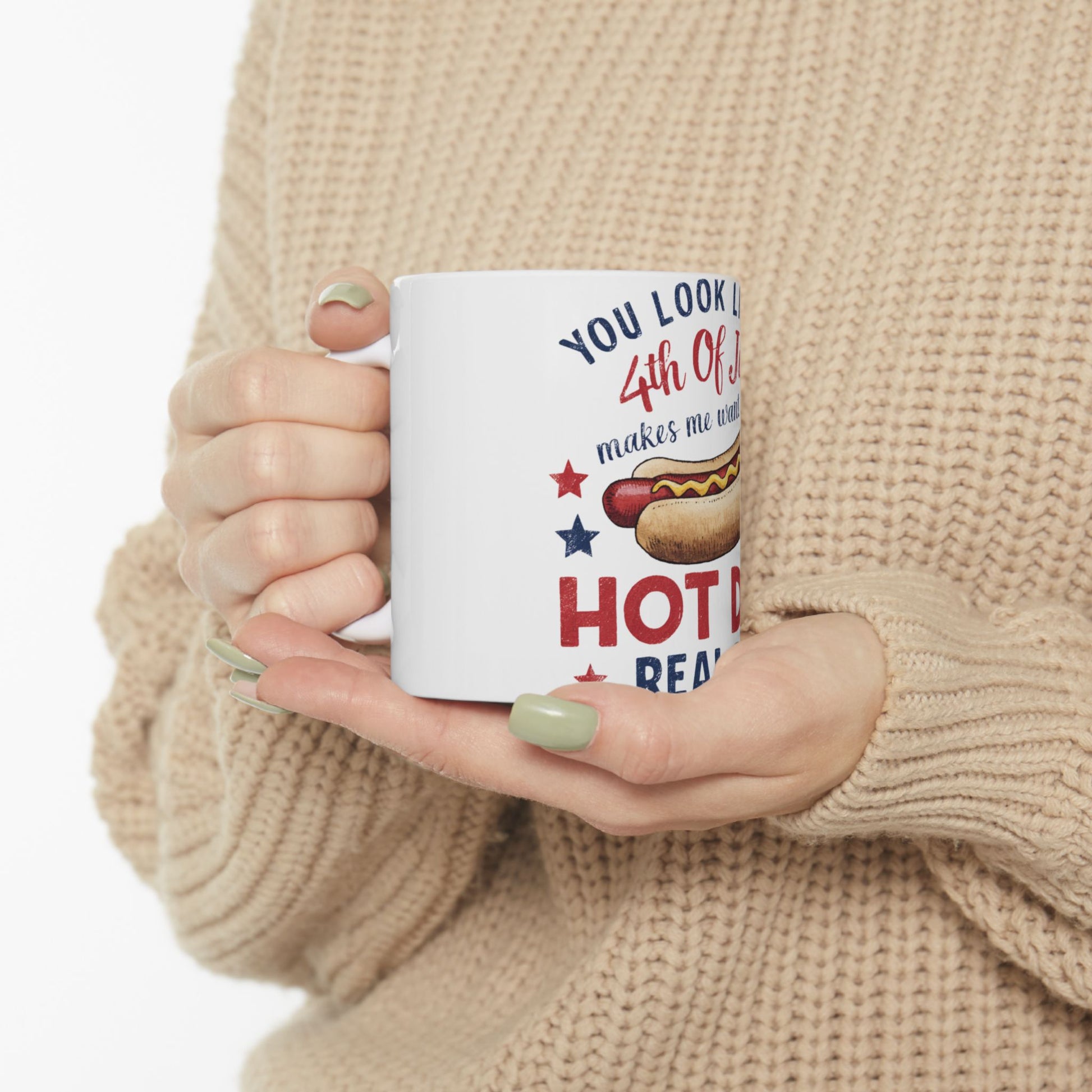 White mug with "You look delicious" and hot dog graphic for Fourth of July.