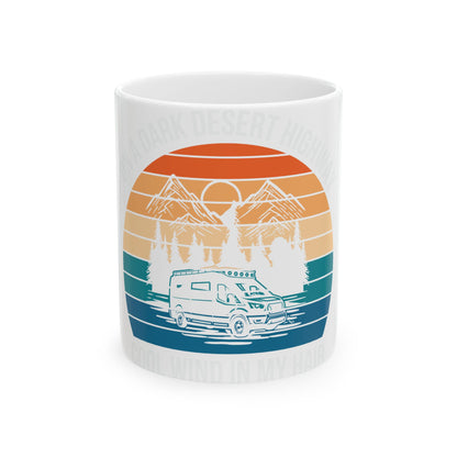 RV on a dark desert highway with mountains and trees, vintage style.