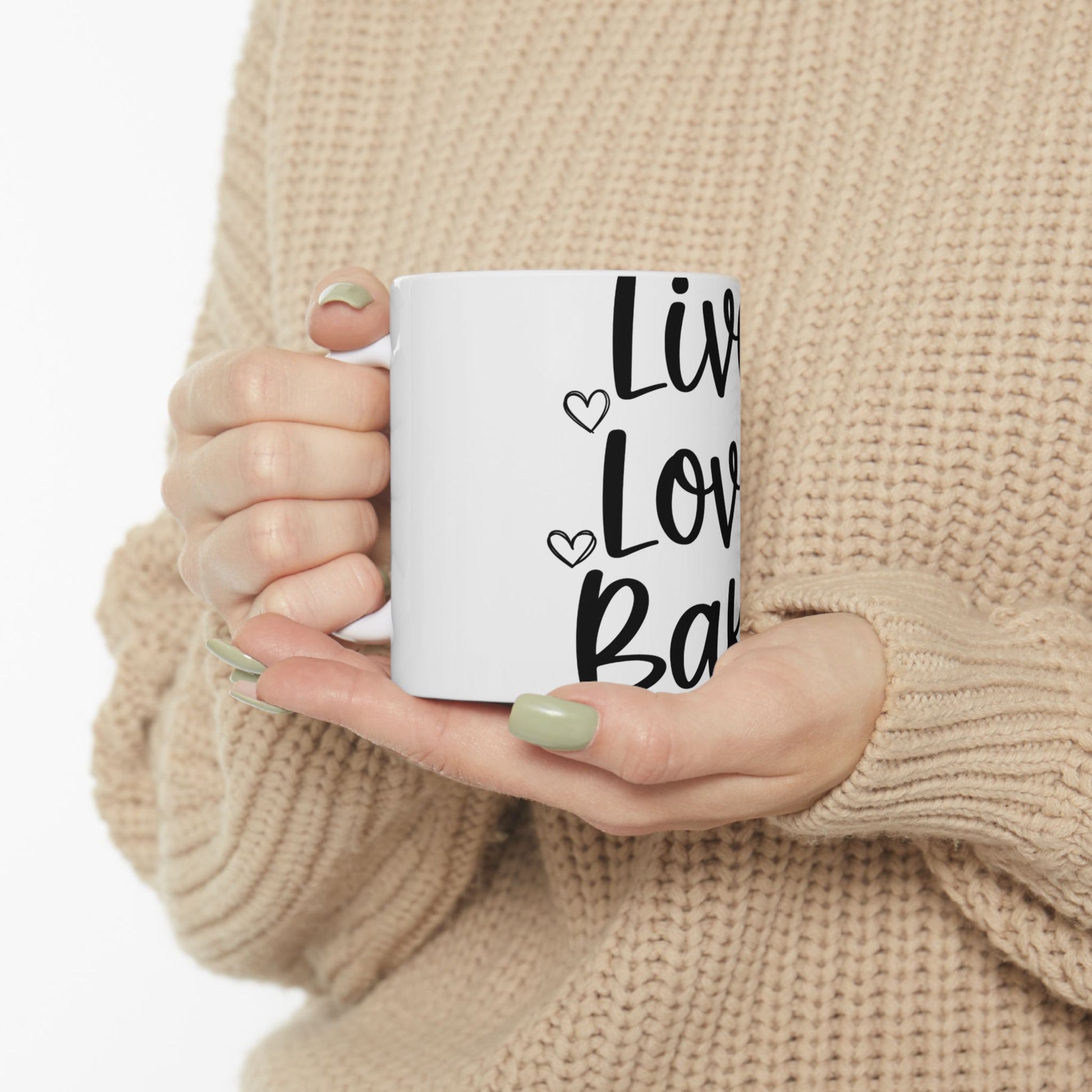 White mug with "Live Laugh Love" text in black cursive font.