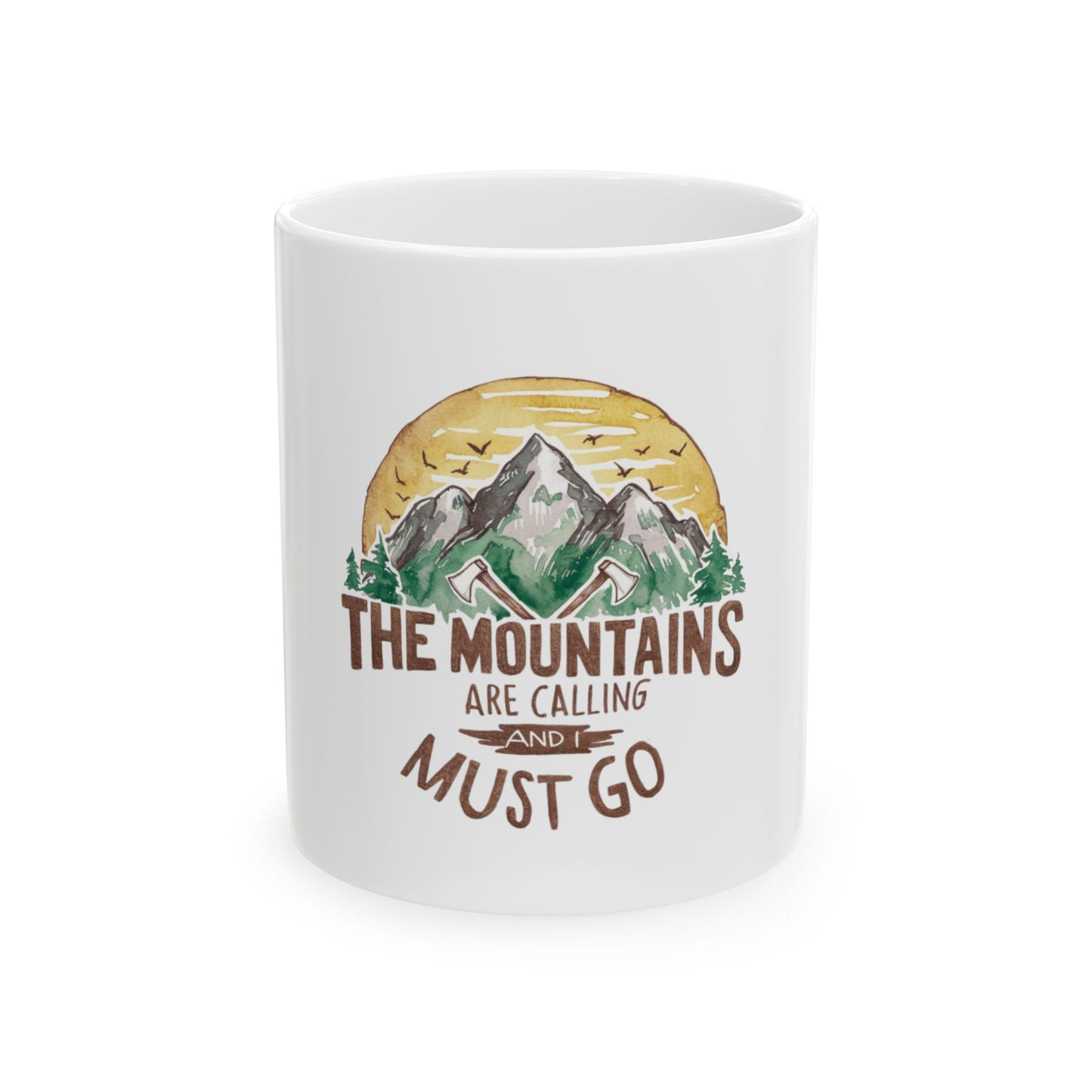 White mug with mountains, trees, and text "The Mountains Are Calling".