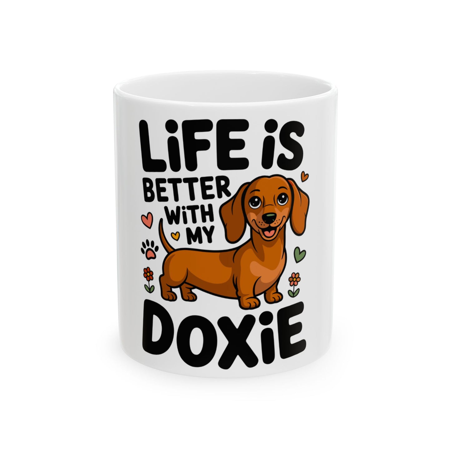 White mug with a cartoon dachshund and "Life is better with my Doxie" text.