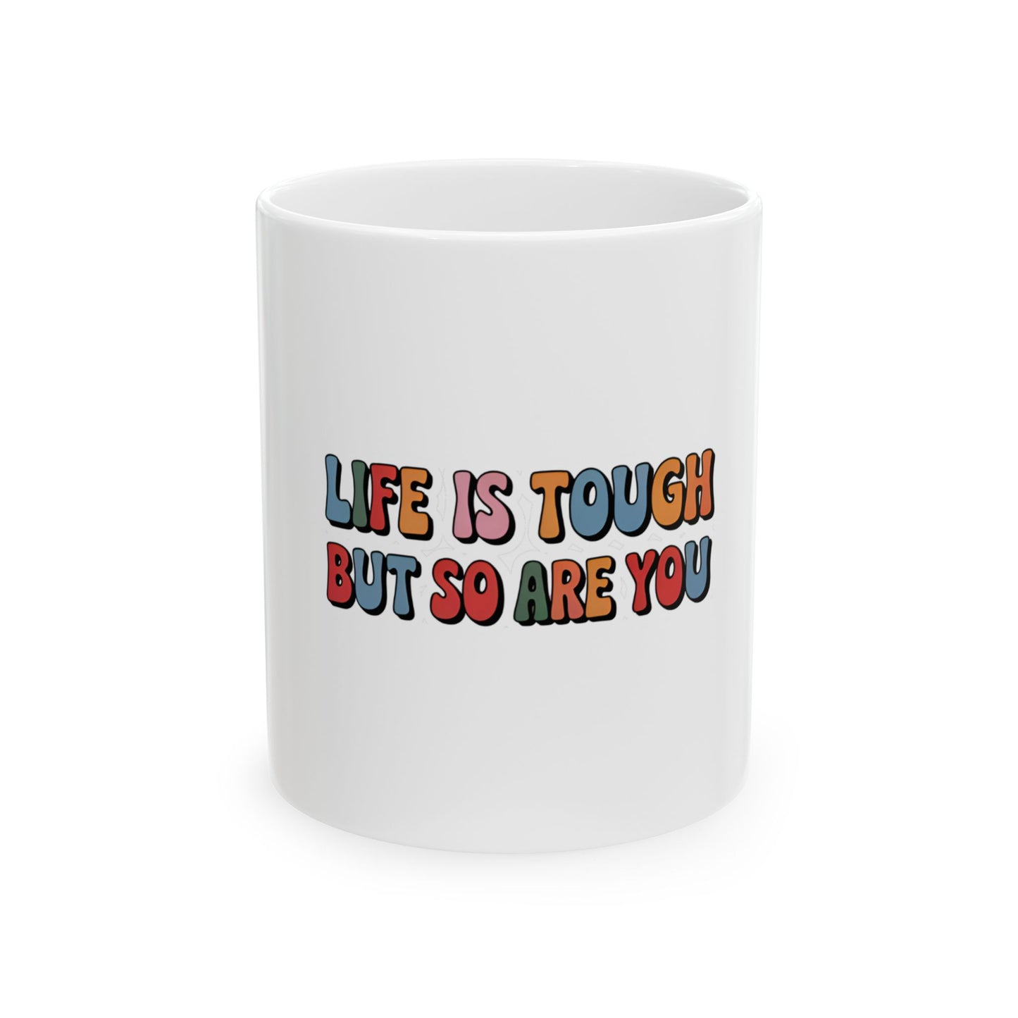 White mug with "Life is tough but so are you" in colorful retro text.