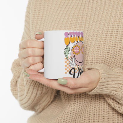 White mug with "Sunny Vibes" text, sunglasses, and peace sign graphic.